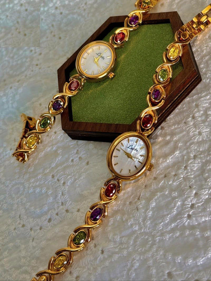 Stylish women's watch with an interchangeable gemstone bracelet, offering a touch of multicolor elegance and versatility