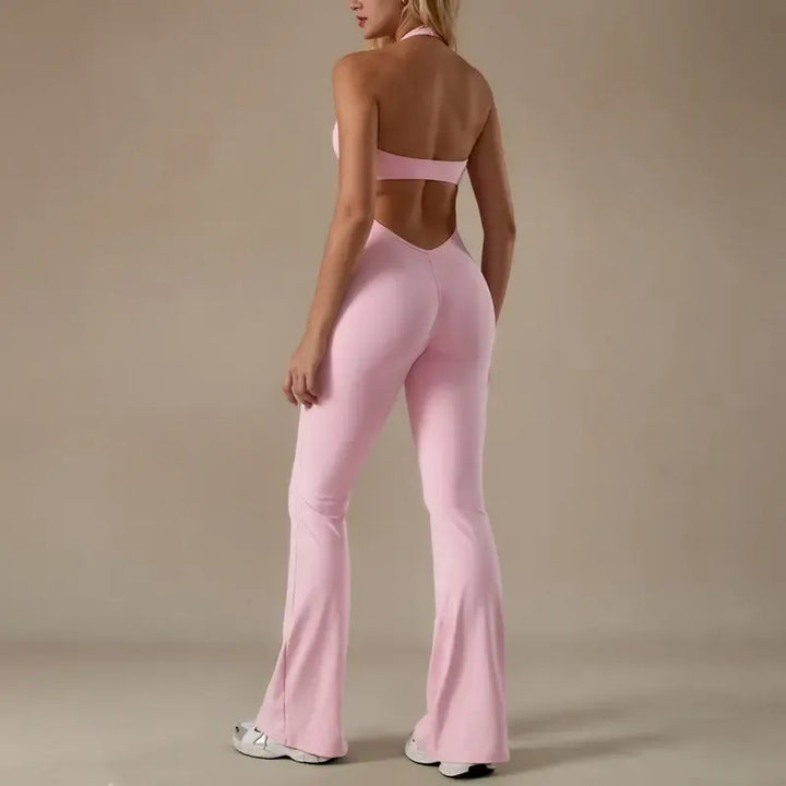 Rear view of women's one-piece halter neck jumpsuit, emphasizing contoured fit and sophisticated style