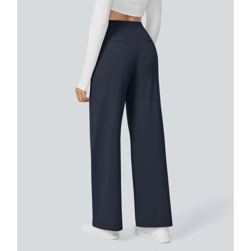 Full length shot of women's wide leg tailored trousers, high waisted, paired with a chic top.