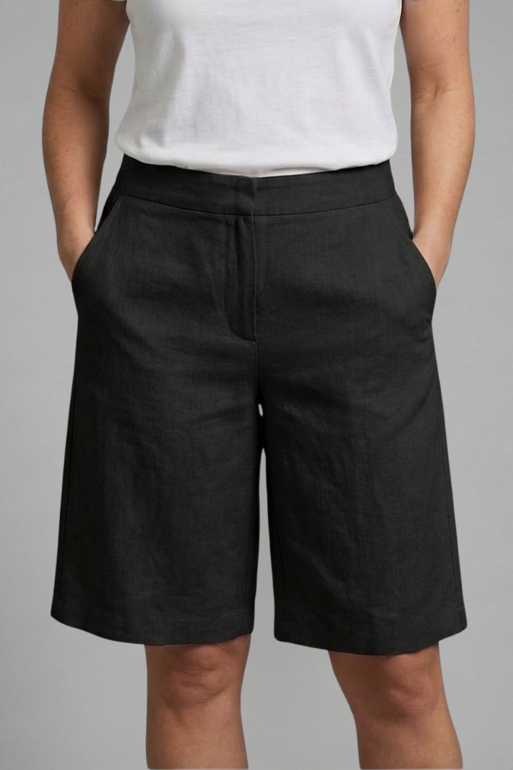 Sophisticated flat-front knee-length tailored shorts for women, excellent for smart casual summer wear.