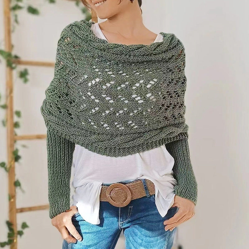 Elegant women's knitted scarf with sleeves, a cozy winter fashion accessory in a warm, neutral tone.