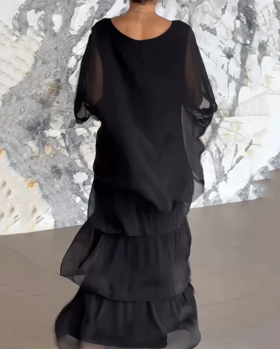 Stylish women's layered maxi dress. Elegant, flowy A-line for vacation, party, or casual chic fashion.