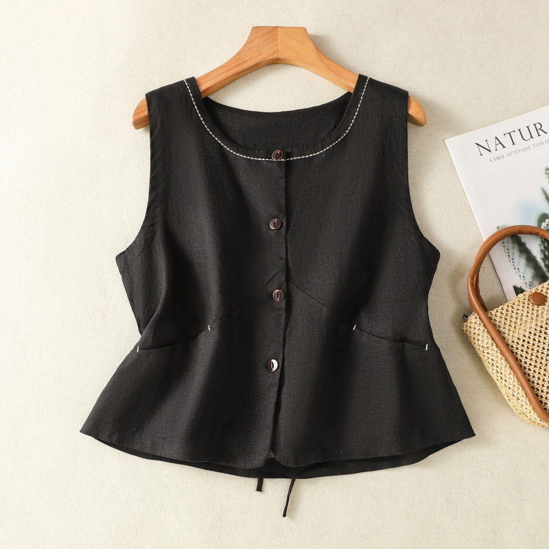 Close-up of a breathable women's linen vest, showcasing fabric texture and tailored sleeveless design.