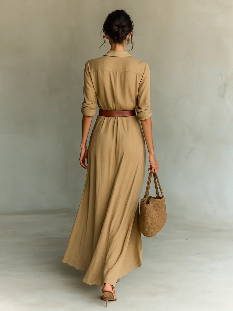 Chic women's fall fashion: an elegant long sleeve maxi dress with a stylish belt and V-neckline.