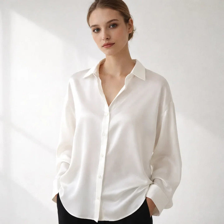Professional women's long sleeve elegant office blouse. Loose fit design ensures comfortable, stylish workwear.