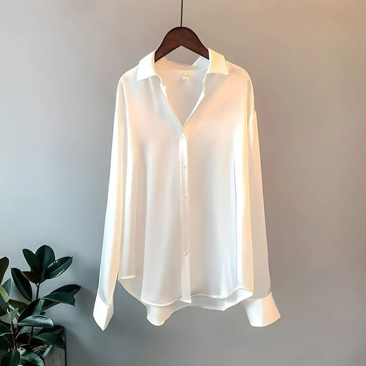 Stylish women's long sleeve loose office blouse. Elegant and versatile for professional workwear fashion apparel.