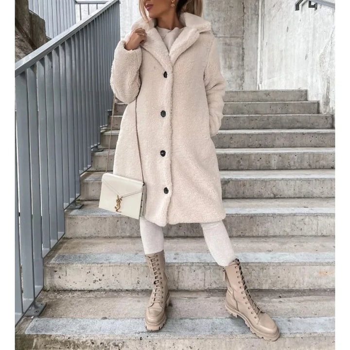 Women's faux shearling long coat, stylish outerwear featuring a soft texture, ideal for an elegant winter look.