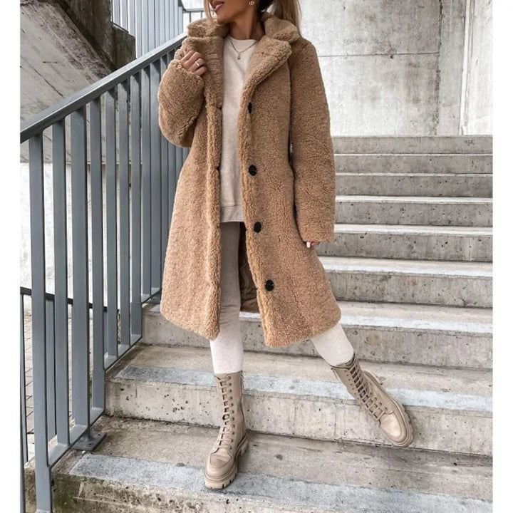 Warm women's winter coat, longline faux shearling design, a cozy jacket for ultimate comfort and fashion.
