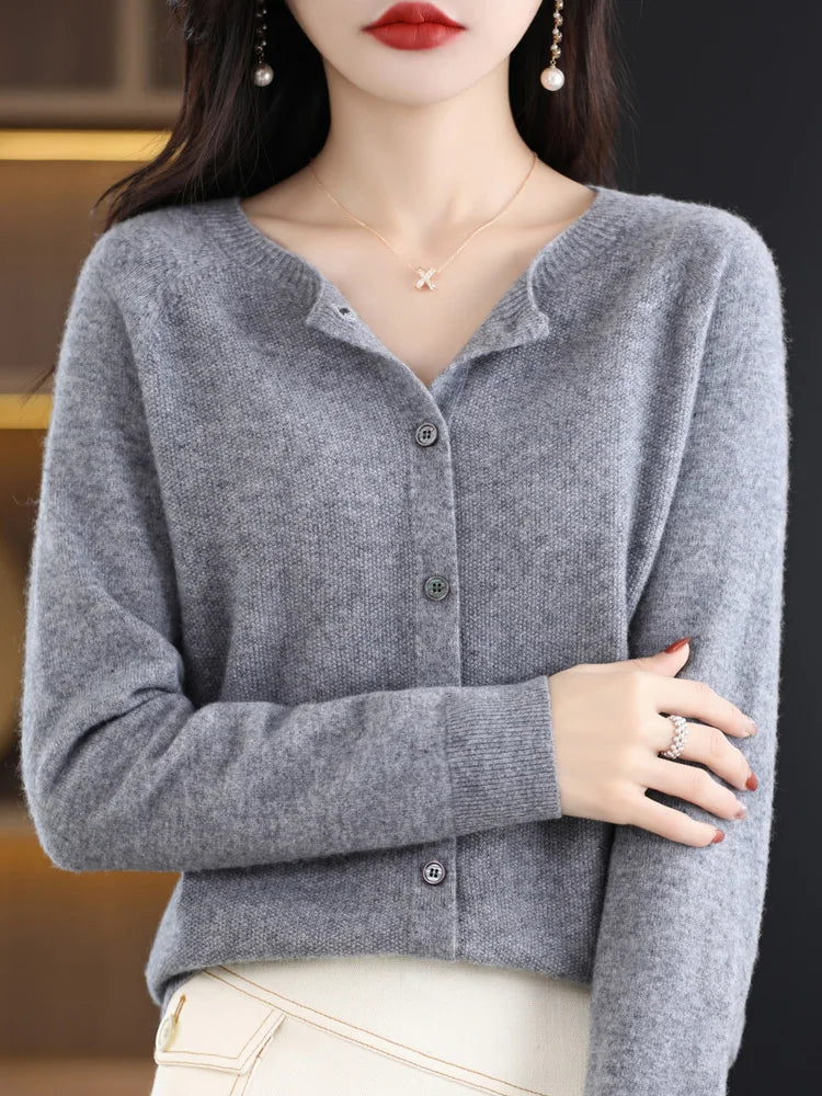 Side profile of a women's soft and warm merino wool O-neck sweater, showing relaxed fit