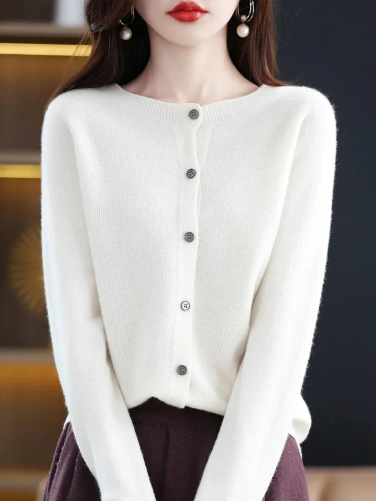 Detail of the O-neck collar on a women's fine-knit merino wool sweater, emphasizing quality