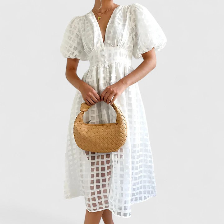 Chic women's midi dress, ideal for wedding guests. Elegant spring/summer style perfect for special celebrations.