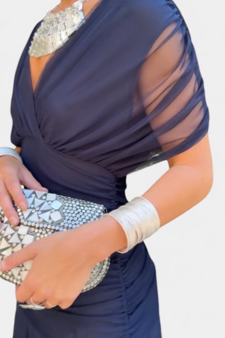Elegant women's off-shoulder party dress, featuring intricate ruching and a chic twist design.