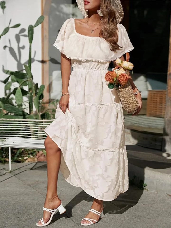 Stunning off shoulder tiered maxi dress, featuring ruffles and lace details for special occasions.