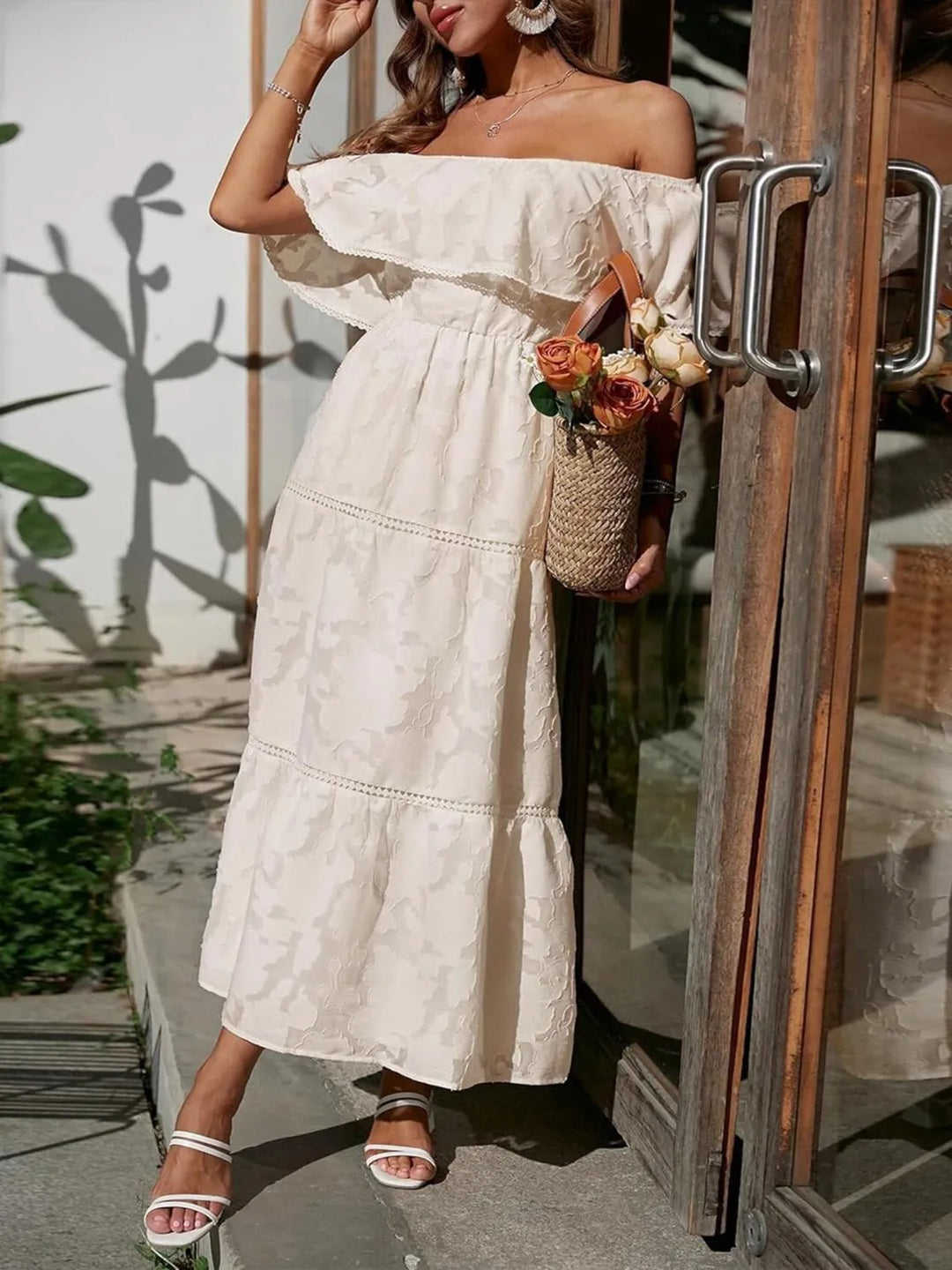 Classy off shoulder maxi dress with tiered ruffles, perfect for a wedding guest outfit.