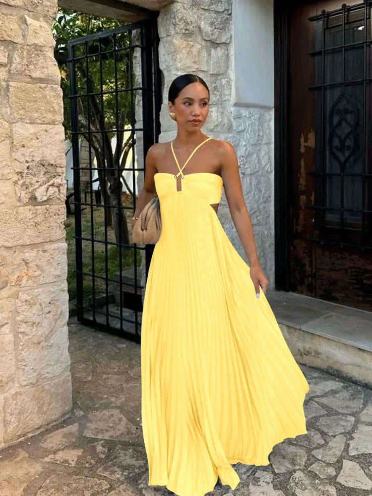 Stylish halter neck maxi dress for women, featuring a beautiful pleated skirt and elegant cut-out detail.