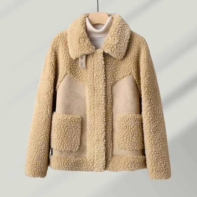 Stylish woman modeling a warm Renard wool blend sherpa coat, perfect for winter elegance