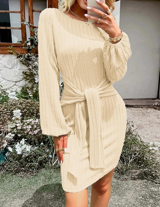 Full-length view of a women's long sleeve ribbed midi dress featuring a flattering waist tie