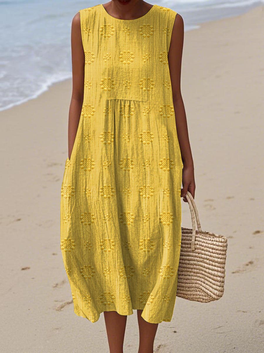 Stylish patterned women's midi dress, sleeveless with a round neck. Ideal casual or elegant day dress for warm weather.