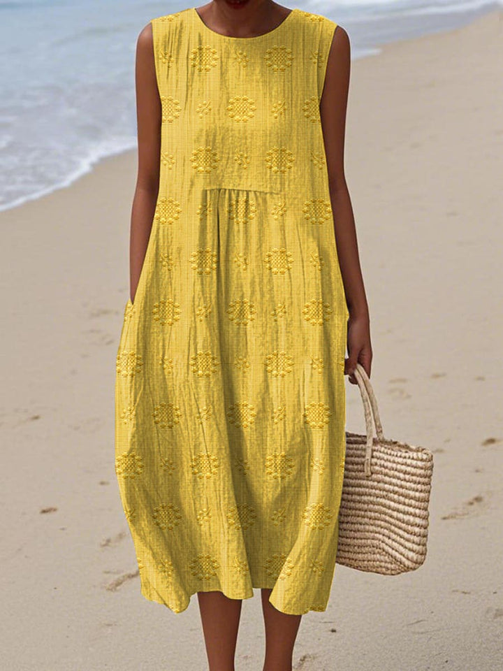 Stylish patterned women's midi dress, sleeveless with a round neck. Ideal casual or elegant day dress for warm weather.