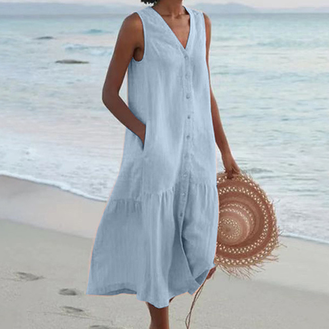 Casual women's button-front midi dress, sleeveless, featuring a V-neck and tiered skirt for a relaxed summer look.