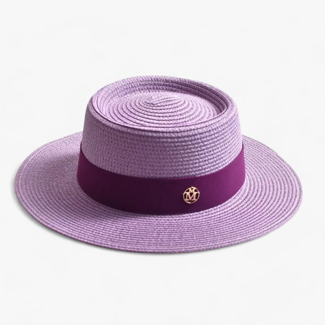 Chic women's straw sun hat. Elegant wide brim design for summer fashion, travel, & sun protection.