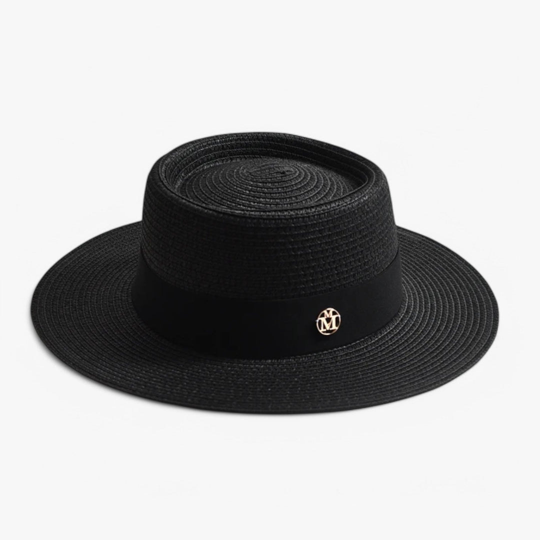 Women's elegant straw beach hat with a wide brim, perfect for summer fashion & UV protection.
