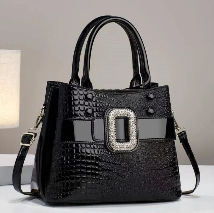 Stylish women's handbag with a unique textured lizard pattern, a must-have elegant accessory.