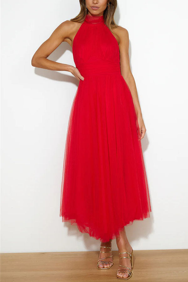 Close-up of delicate tulle fabric on an elegant women's midi dress for formal events.