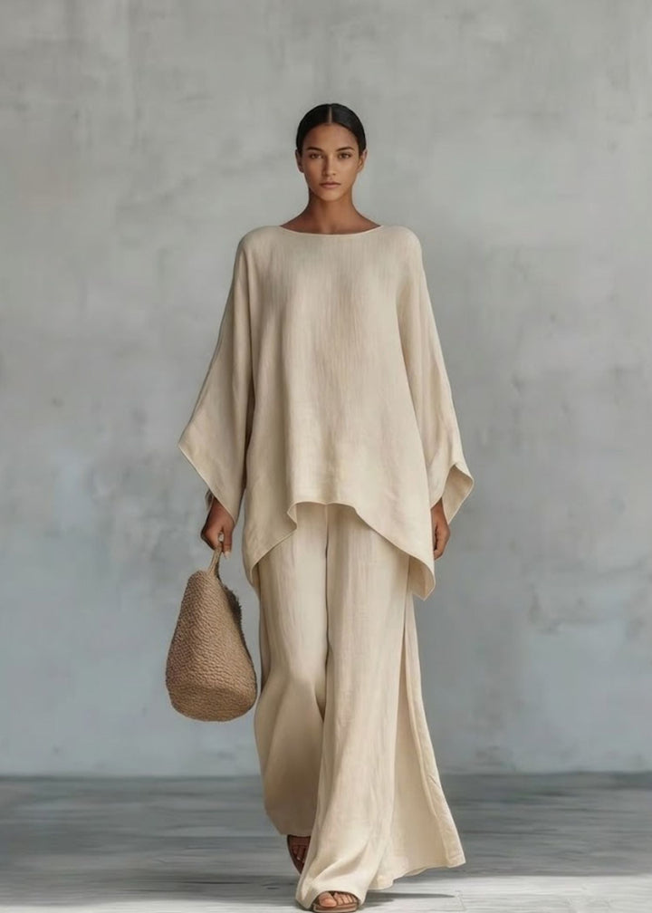 Sophisticated resort wear set for women, featuring a luxurious cape top and breezy wide-leg pants, perfect for vacation.
