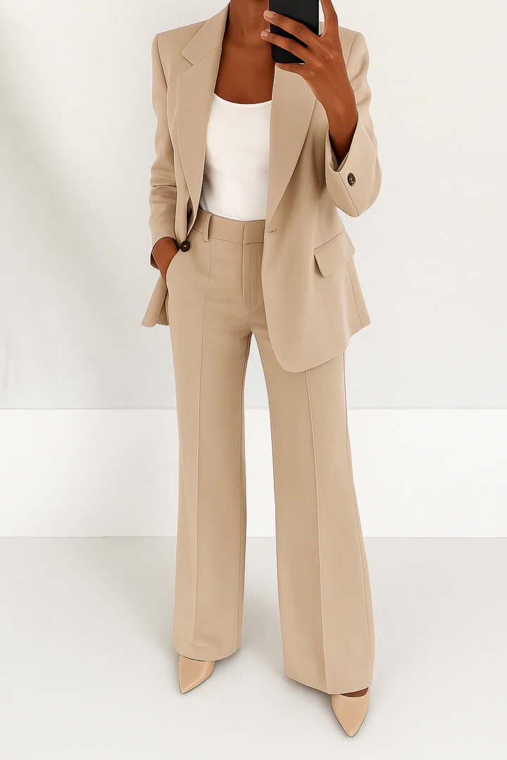 Stylish women's matching set with a sophisticated blazer and trousers for formal occasions.
