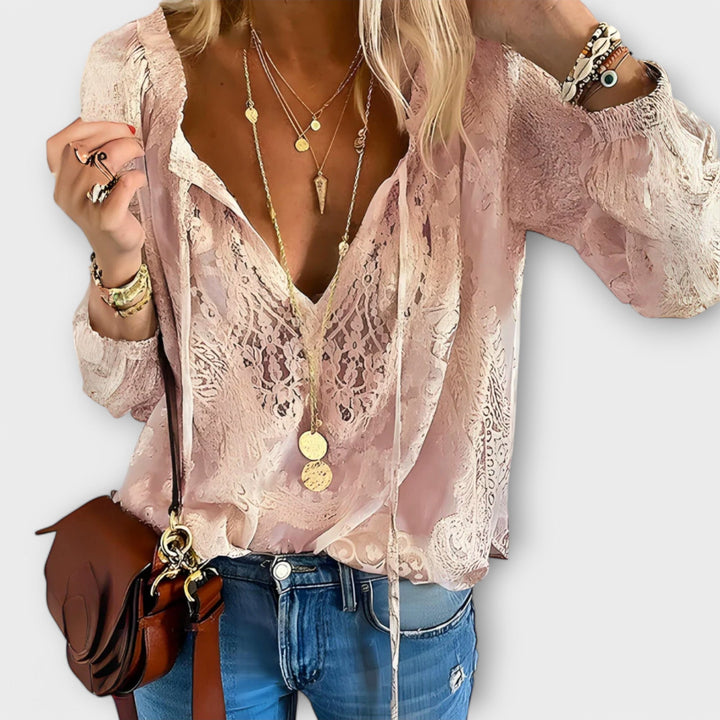 Relaxed fit pink long sleeve V-neck blouse with delicate lace details, a versatile and elegant women's fashion top.