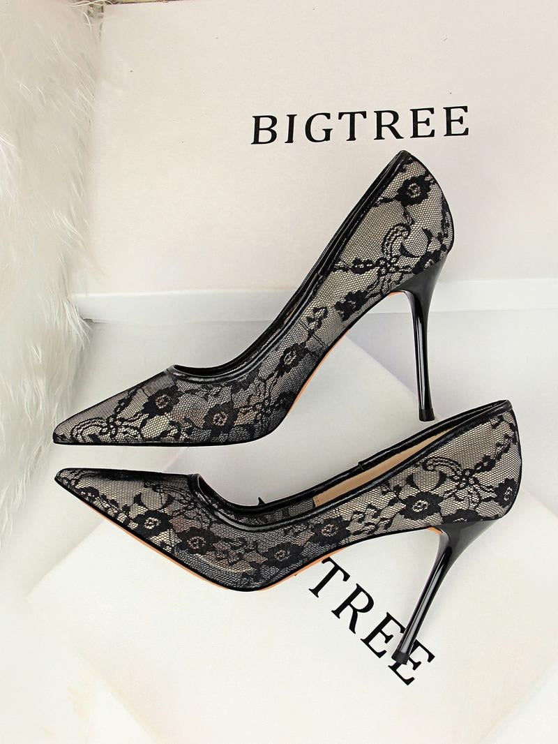Elegant women's white lace pointed-toe stiletto heels, perfect for evening parties.
