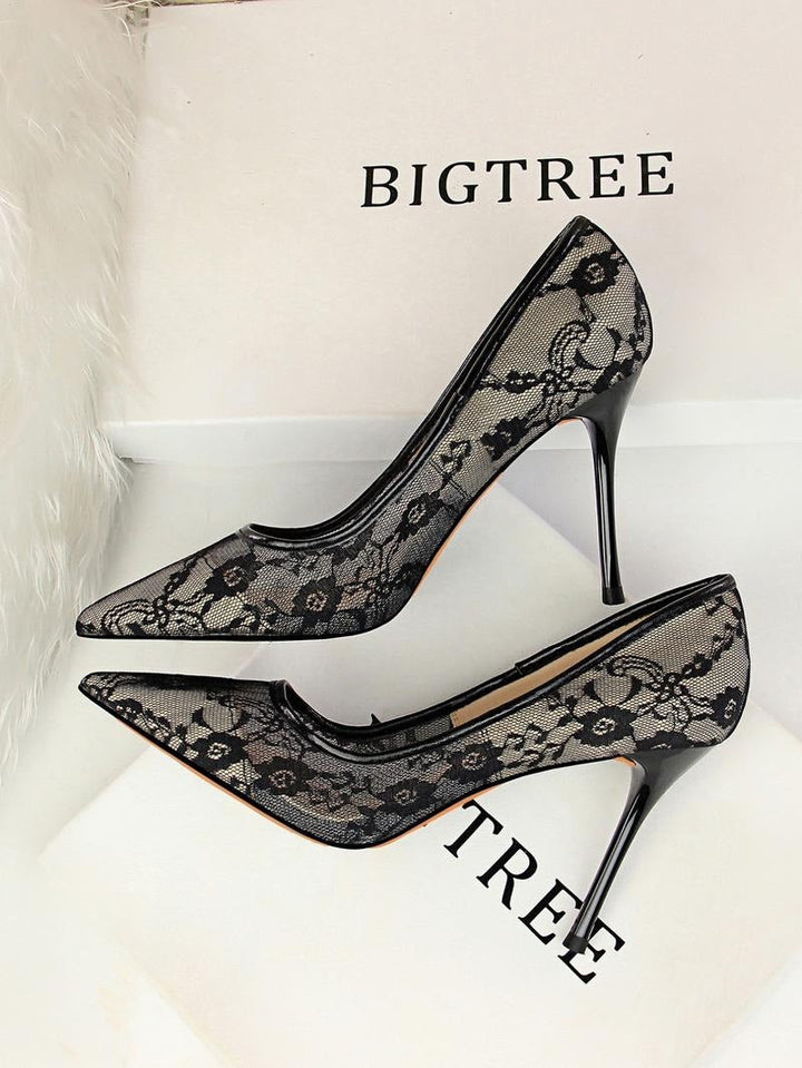 Elegant women's white lace pointed-toe stiletto heels, perfect for evening parties.