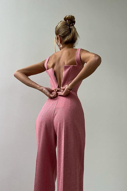"Elegant women's three-piece suit with structured blazer, bustier top, and wide-leg trousers in classic herringbone weave."