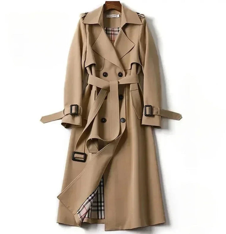 Elegant women's waterproof trench coat with a double-breasted front, waist belt, and storm shields in various colors.