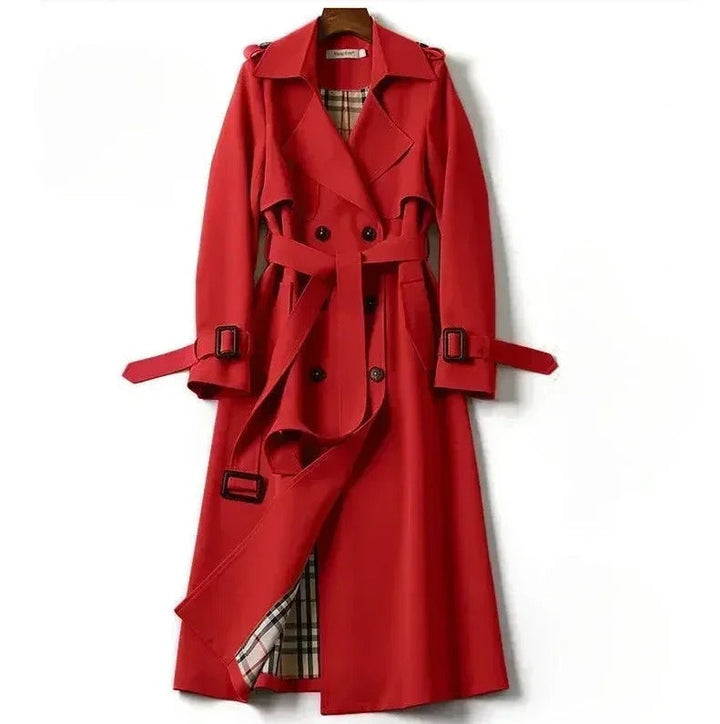 Elegant women's waterproof trench coat with a double-breasted front, waist belt, and storm shields in various colors.