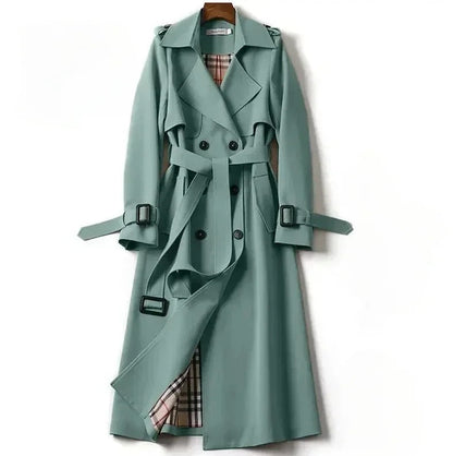 Elegant women's waterproof trench coat with a double-breasted front, waist belt, and storm shields in various colors.