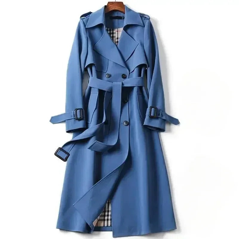 Elegant women's waterproof trench coat with a double-breasted front, waist belt, and storm shields in various colors.