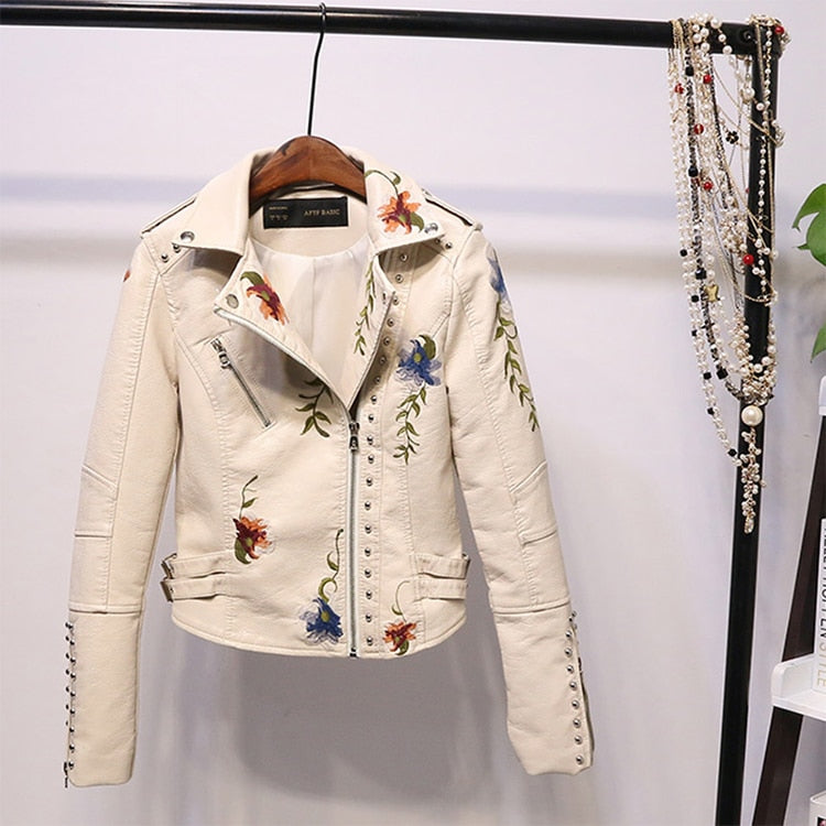 Faux leather women's jacket with detailed floral embroidery, ideal for a chic look.