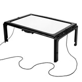 Ergonomic LED magnifier with luminous lens for elderly reading comfort, highlighting ergonomic design and compact portability