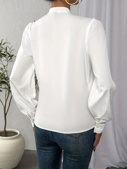 Front view of Women's elegant classic fit long-sleeve blouse, sleek silhouette, suitable for office or casual occasions.