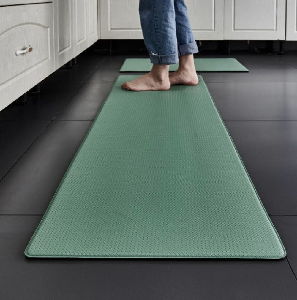 Comfortable anti-fatigue floor mat for kitchen standing, reduces pressure, easy to clean.