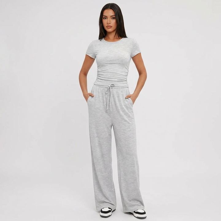Women's comfort 2-piece lounge set with wide leg pants & matching crop top in soft rayon blend, ideal for casual wear.