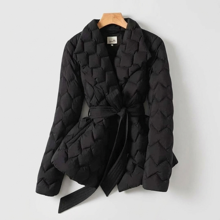 Women's elegant long belted down coat, ideal winter outerwear. Provides superior warmth and fashionable cold weather protection.