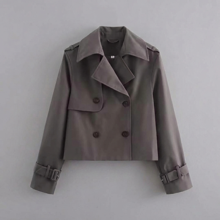 Fashionable women's cropped trench coat with double buttons. Chic spring & fall outerwear for a stylish light layer.