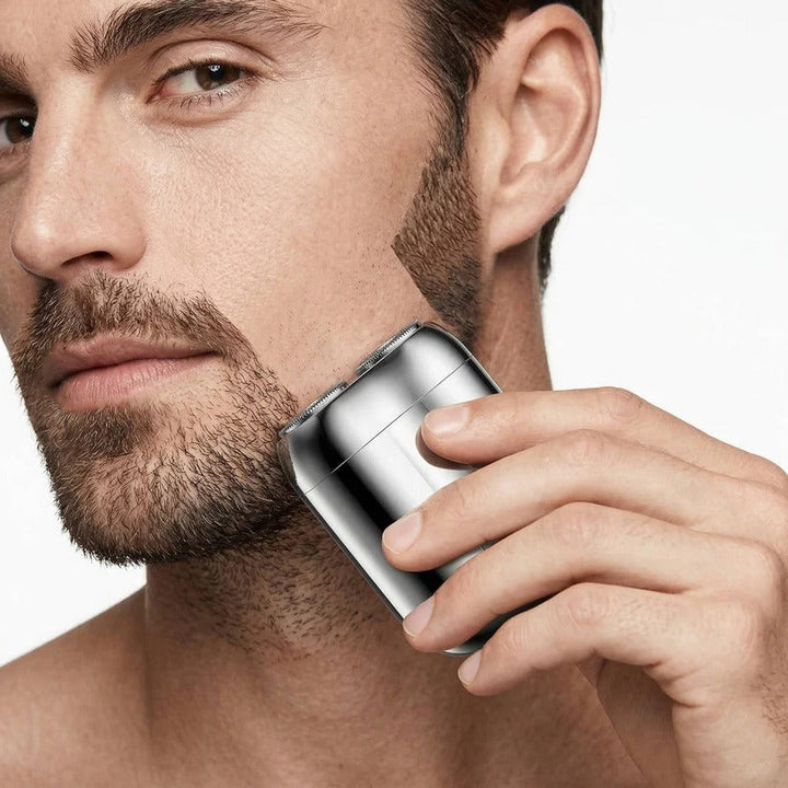 Versatile men's electric shaver for face and body. Waterproof for wet/dry use, essential personal grooming.