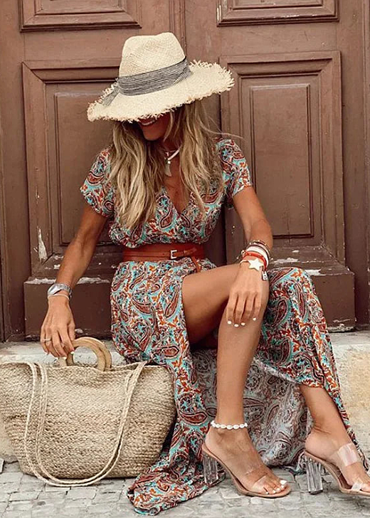 Elegant women's flowy long dress, bohemian floral print, and a fashionable side slit. Ideal for warm weather.