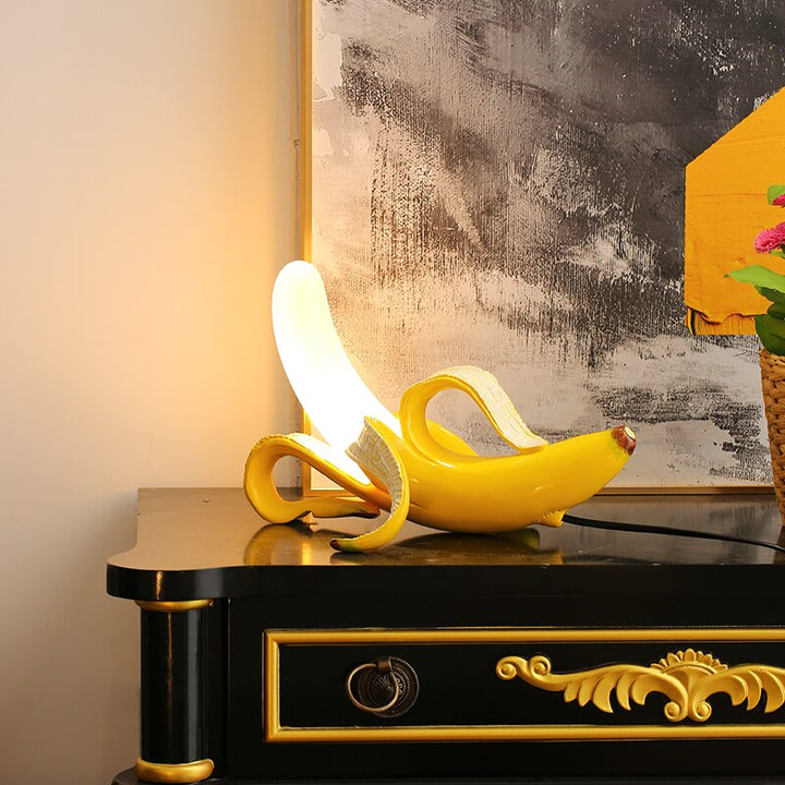 Sleek brass & chrome table lamp, contemporary design, ideal for accent lighting.