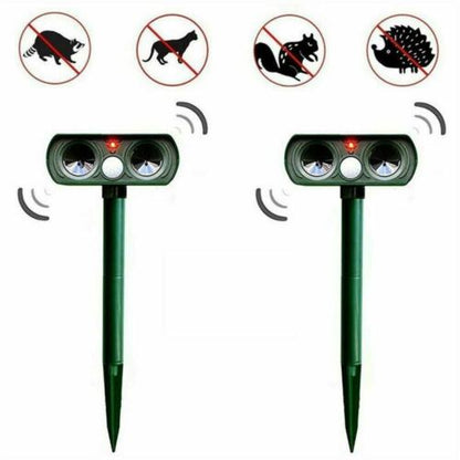 "Infrared Solar Ultrasonic Animal Repeller for garden protection, green device with solar panel and motion detector"