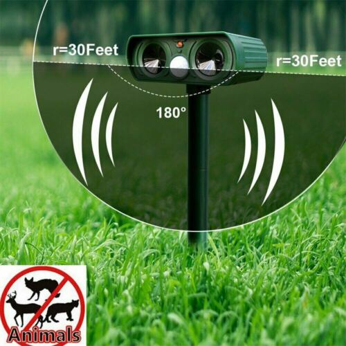 "Infrared Solar Ultrasonic Animal Repeller for garden protection, green device with solar panel and motion detector"